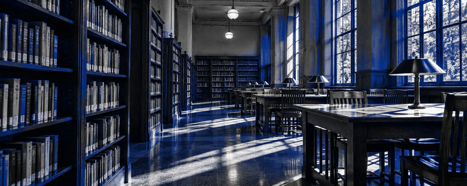 Empty school library with shelves and study tables, in cobalt duotone.